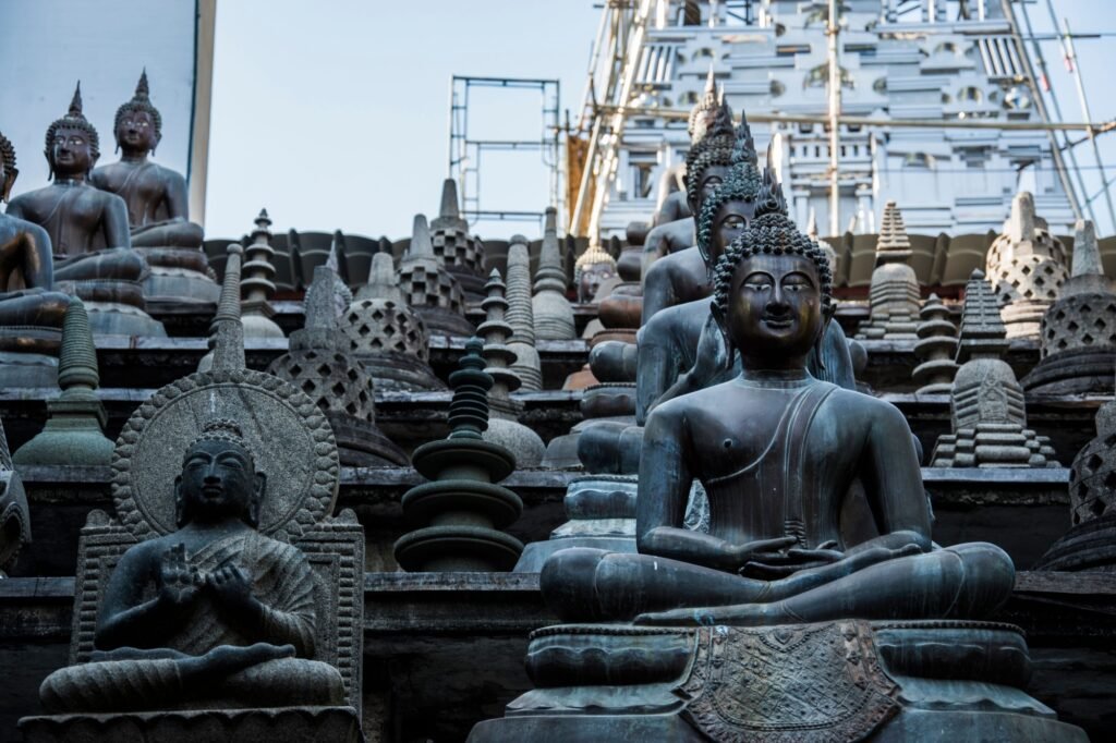 Buddha statues and small stupas in Gangaramaya temple, Colombo, Sri Lanka.